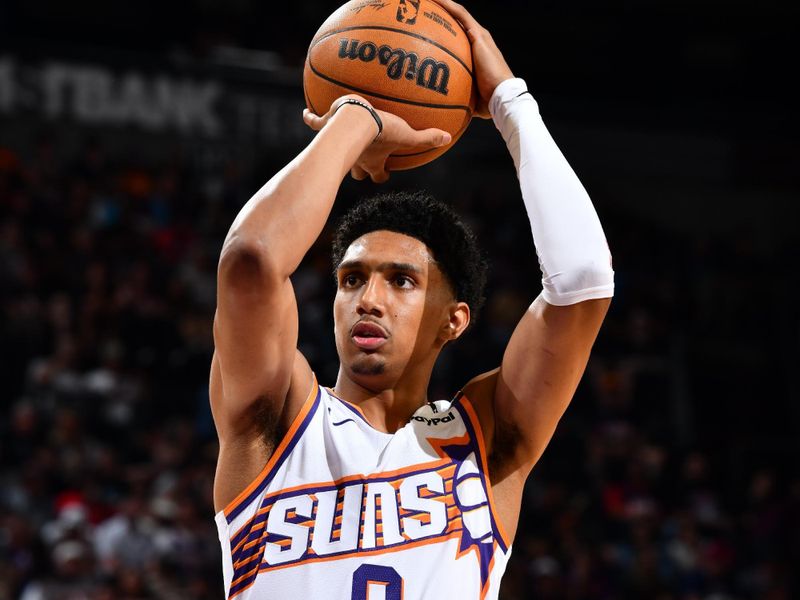 PHOENIX, AZ - OCTOBER 11: Ryan Dunn #0 of the Phoenix Suns shoots a free throw during the game against the Detroit Pistons during a NBA preseason game on October 11, 2024 at Footprint Center in Phoenix, Arizona. NOTE TO USER: User expressly acknowledges and agrees that, by downloading and or using this photograph, user is consenting to the terms and conditions of the Getty Images License Agreement. Mandatory Copyright Notice: Copyright 2024 NBAE (Photo by Barry Gossage/NBAE via Getty Images)