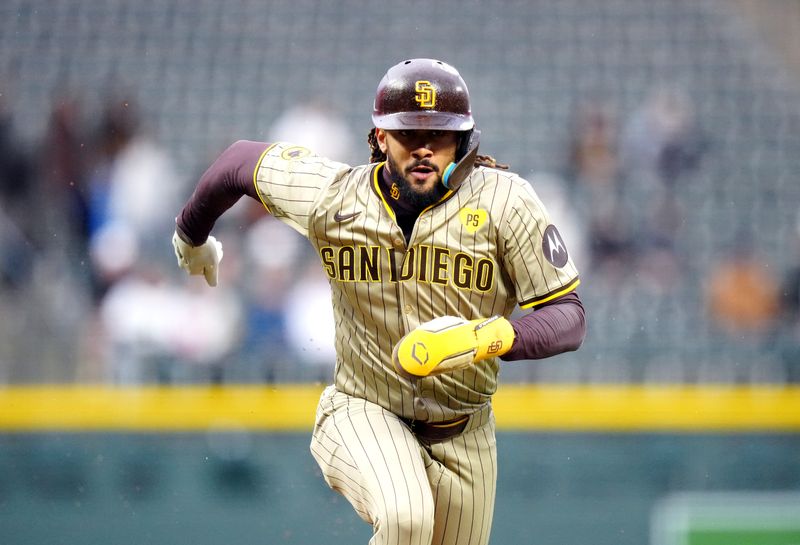 Apr 23, 2024; Denver, Colorado, USA; San Diego Padres outfielder Fernando Tatis Jr. (23) heads home to score in the first inning against the Colorado Rockies at Coors Field. Mandatory Credit: Ron Chenoy-USA TODAY Sports