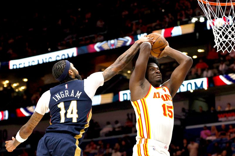 NEW ORLEANS, LOUISIANA - NOVEMBER 03: Clint Capela #15 of the Atlanta Hawks is blocked by Brandon Ingram #14 of the New Orleans Pelicans during the second quarter at Smoothie King Center on November 03, 2024 in New Orleans, Louisiana. NOTE TO USER: User expressly acknowledges and agrees that, by downloading and or using this photograph, User is consenting to the terms and conditions of the Getty Images License Agreement. (Photo by Sean Gardner/Getty Images)