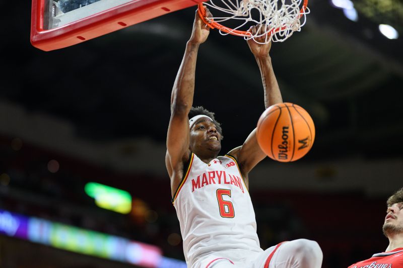 Dec 4, 2024; College Park, Maryland, USA; Maryland Terrapins forward Tafara Gapare (6) dunks the ball during the second half against the Ohio State Buckeyes at Xfinity Center. Mandatory Credit: Reggie Hildred-Imagn Images