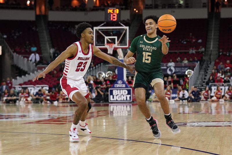 Feb 3, 2024; Fresno, California, USA; Colorado State Rams guard Jalen Lake (15) passes the ball next to Fresno State Bulldogs guard Leo Colimerio (23) in the first half at the Save Mart Center. Mandatory Credit: Cary Edmondson-USA TODAY Sports