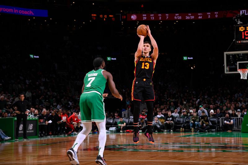 BOSTON, MA - FEBRUARY 7: Bogdan Bogdanovic #13 of the Atlanta Hawks shoots a three point basket during the game against the Boston Celtics on February 7, 2024 at the TD Garden in Boston, Massachusetts. NOTE TO USER: User expressly acknowledges and agrees that, by downloading and or using this photograph, User is consenting to the terms and conditions of the Getty Images License Agreement. Mandatory Copyright Notice: Copyright 2024 NBAE  (Photo by Brian Babineau/NBAE via Getty Images)