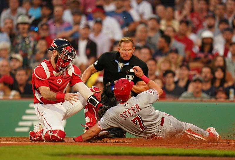 Jun 1, 2023; Boston, Massachusetts, USA; Cincinnati Reds first baseman Spencer Steer (7) tagged out at home plate by Boston Red Sox catcher Connor Wong (12) in the fourth inning at Fenway Park. Mandatory Credit: David Butler II-USA TODAY Sports