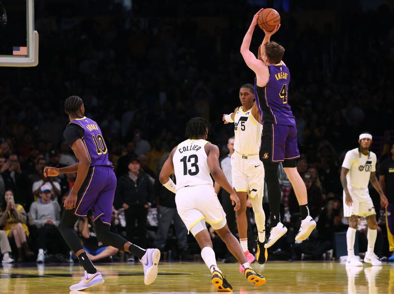 LOS ANGELES, CALIFORNIA - NOVEMBER 19: Dalton Knecht #4 of the Los Angeles Lakers attempts his fifth consecutive three pointer as he is fouled by Cody Williams #5 of the Utah Jazz, Knecht would shoot nine three pointers and score 37 points, during a 124-118 Lakers win at Crypto.com Arena on November 19, 2024 in Los Angeles, California. (Photo by Harry How/Getty Images) NOTE TO USER: User expressly acknowledges and agrees that, by downloading and or using this photograph, User is consenting to the terms and conditions of the Getty Images License Agreement.  (Photo by Harry How/Getty Images)