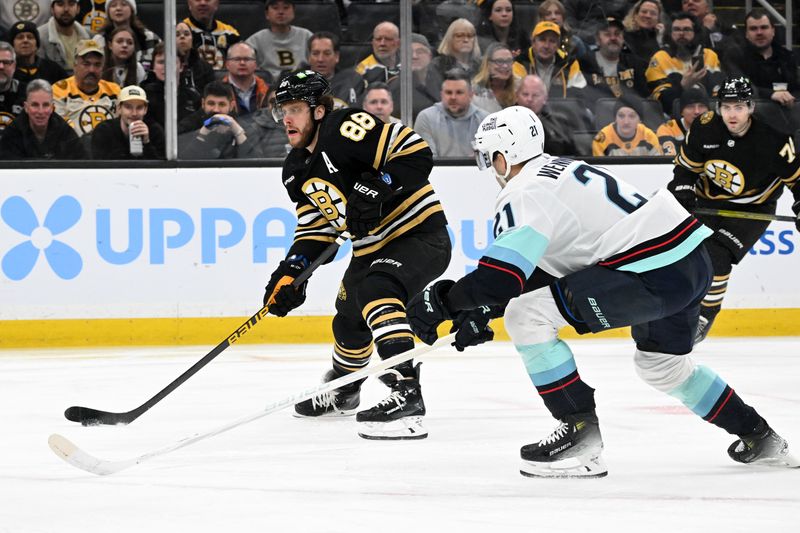 Feb 15, 2024; Boston, Massachusetts, USA; Boston Bruins right wing David Pastrnak (88) skates against Seattle Kraken center Alex Wennberg (21) during the first period at TD Garden. Mandatory Credit: Brian Fluharty-USA TODAY Sports