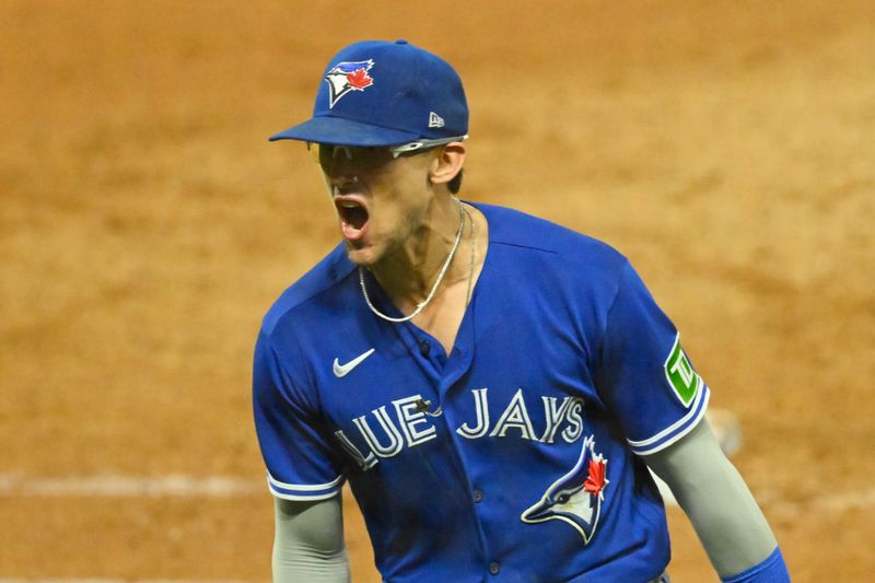 Aug 7, 2023; Cleveland, Ohio, USA; Toronto Blue Jays second baseman Cavan Biggio (8) reacts after completing an unassisted double play in the eighth inning against the Cleveland Guardians at Progressive Field. Mandatory Credit: David Richard-USA TODAY Sports