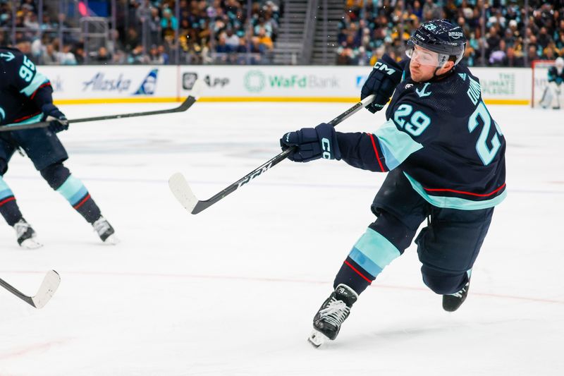 Feb 26, 2024; Seattle, Washington, USA; Seattle Kraken defenseman Vince Dunn (29) scores a goal against the Boston Bruins during the third period at Climate Pledge Arena. Mandatory Credit: Joe Nicholson-USA TODAY Sports