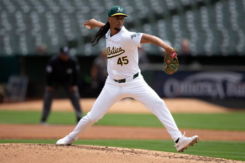 Aug 22, 2024; Oakland, California, USA; Oakland Athletics starting pitcher Osvaldo Bido (45) delivers a pitch against the Tampa Bay Rays during the second inning at Oakland-Alameda County Coliseum. Mandatory Credit: D. Ross Cameron-USA TODAY Sports