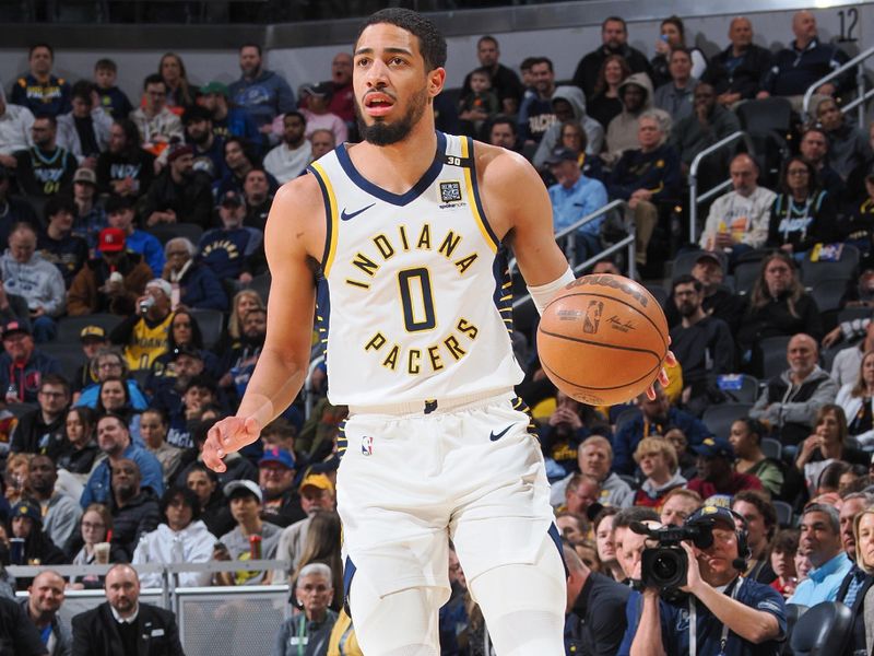 INDIANAPOLIS, IN - MARCH 18:  Tyrese Haliburton #0 of the Indiana Pacers handles the ball during the game  on March 18, 2024 at Gainbridge Fieldhouse in Indianapolis, Indiana. NOTE TO USER: User expressly acknowledges and agrees that, by downloading and or using this Photograph, user is consenting to the terms and conditions of the Getty Images License Agreement. Mandatory Copyright Notice: Copyright 2024 NBAE (Photo by Ron Hoskins/NBAE via Getty Images)