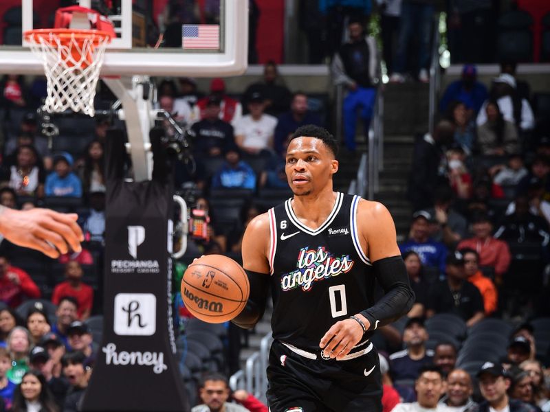 LOS ANGELES, CA - MARCH 18: Russell Westbrook  #0 of the LA Clippers moves the ball during the game against the Orlando Magic on March 18, 2023 at Crypto.Com Arena in Los Angeles, California. NOTE TO USER: User expressly acknowledges and agrees that, by downloading and/or using this Photograph, user is consenting to the terms and conditions of the Getty Images License Agreement. Mandatory Copyright Notice: Copyright 2023 NBAE (Photo by Adam Pantozzi/NBAE via Getty Images)