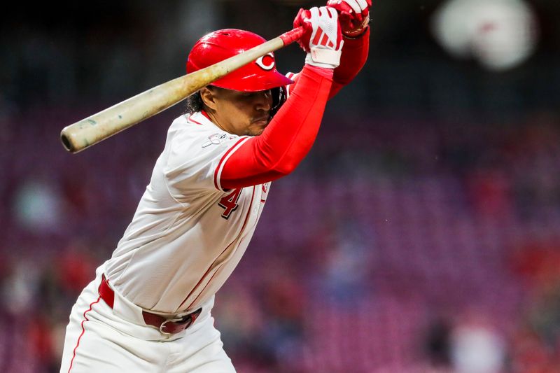 Apr 22, 2024; Cincinnati, Ohio, USA; Cincinnati Reds second baseman Santiago Espinal (4) dodges a wild pitch against the Philadelphia Phillies in the eighth inning at Great American Ball Park. Mandatory Credit: Katie Stratman-USA TODAY Sports