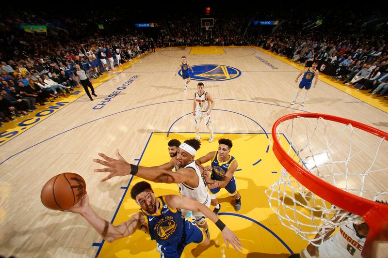 SAN FRANCISCO, CA - FEBRUARY 25: Klay Thompson #11 of the Golden State Warriors shoots the ball during the game against the Denver Nuggets on February 25, 2024 at Chase Center in San Francisco, California. NOTE TO USER: User expressly acknowledges and agrees that, by downloading and or using this photograph, user is consenting to the terms and conditions of Getty Images License Agreement. Mandatory Copyright Notice: Copyright 2024 NBAE (Photo by Jed Jacobsohn/NBAE via Getty Images)