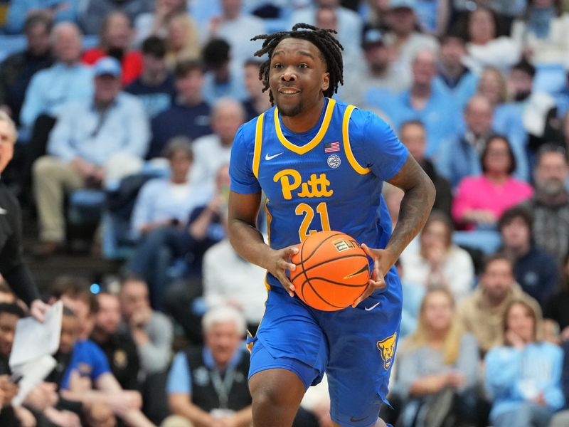 Feb 14, 2026; Chapel Hill, North Carolina, USA; Pittsburgh Panthers guard MacAri Moore (21) looks to pass in the first half at Dean E. Smith Center. Mandatory Credit: Bob Donnan-Imagn Images