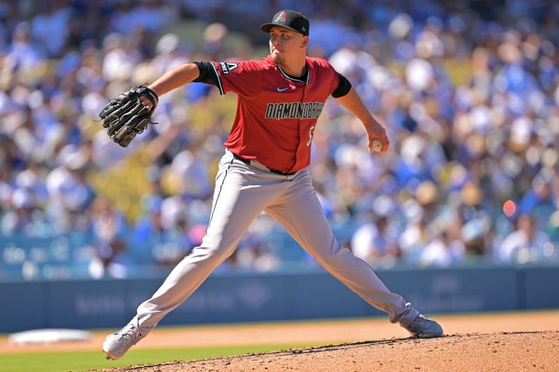 Aug 31, 2025; Los Angeles, California, USA;  Arizona Diamondbacks relief pitcher Brandyn Garcia (55) delivers to the plate against the Los Angeles Dodgers at Dodger Stadium. Mandatory Credit: Jayne Kamin-Oncea-Imagn Images