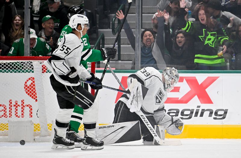 Jan 16, 2024; Dallas, Texas, USA; Los Angeles Kings goaltender Cam Talbot (39) reacts to allowing a shorthanded goal to Dallas Stars center Sam Steel (not pictured) as Stars center Radek Faksa (12) and Kings right wing Quinton Byfield (55) look on during the third period at the American Airlines Center. Mandatory Credit: Jerome Miron-USA TODAY Sports