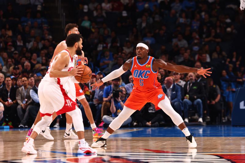 OKLAHOMA CITY, OK - FEBRUARY 27: Luguentz Dort #5 of the Oklahoma City Thunder plays defense during the game against the Houston Rockets on February, 2024 at Paycom Arena in Oklahoma City, Oklahoma. NOTE TO USER: User expressly acknowledges and agrees that, by downloading and or using this photograph, User is consenting to the terms and conditions of the Getty Images License Agreement. Mandatory Copyright Notice: Copyright 2024 NBAE (Photo by Zach Beeker/NBAE via Getty Images)