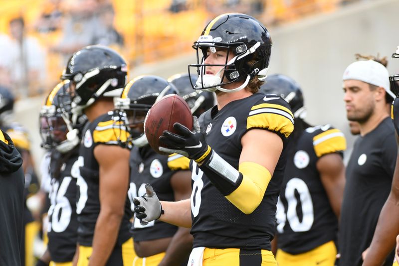 Pittsburgh Steelers quarterback Kenny Pickett (8) warms up before an NFL preseason football game against the Seattle Seahawks, Saturday, Aug. 13, 2022, in Pittsburgh. (AP Photo/Fred Vuich)