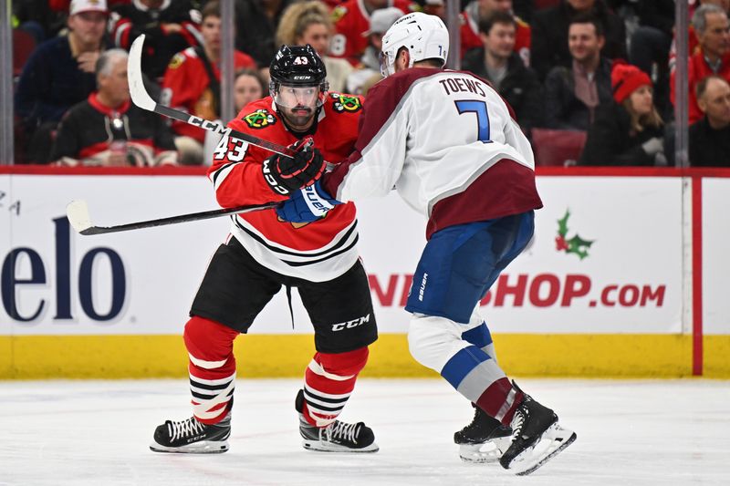 Dec 19, 2023; Chicago, Illinois, USA; Chicago Blackhawks forward Colin Blackwell (43) and Colorado Avalanche defenseman Devon Toews (7) battle for position in the third period at United Center. Mandatory Credit: Jamie Sabau-USA TODAY Sports