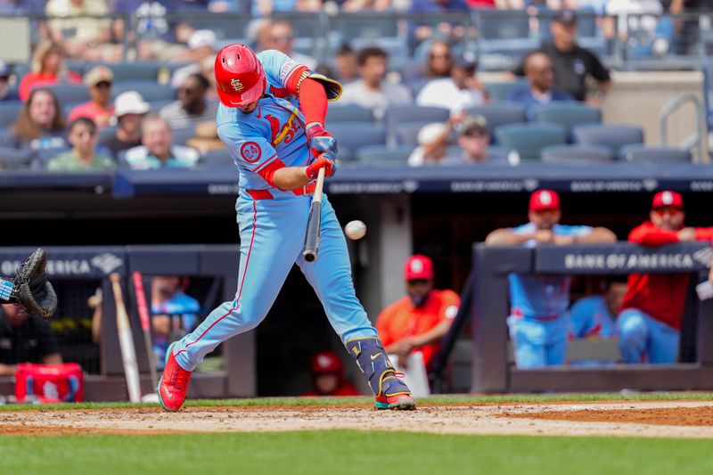 Aug 31, 2024; Bronx, New York, USA; St. Louis Cardinals third baseman Nolan Arenado (28) hits a single against the New York Yankees during the third inning at Yankee Stadium. Mandatory Credit: Gregory Fisher-USA TODAY Sports