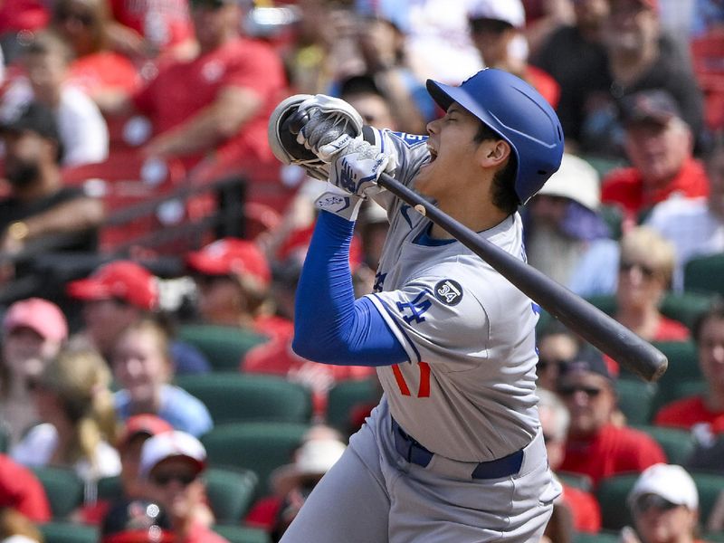 Jun 8, 2025; St. Louis, Missouri, USA;  Los Angeles Dodgers designated hitter Shohei Ohtani (17) reacts after he was hit by a pitch by St. Louis Cardinals relief pitcher Matt Svanson (not pictured) during the eighth inning at Busch Stadium. Mandatory Credit: Jeff Curry-Imagn Images