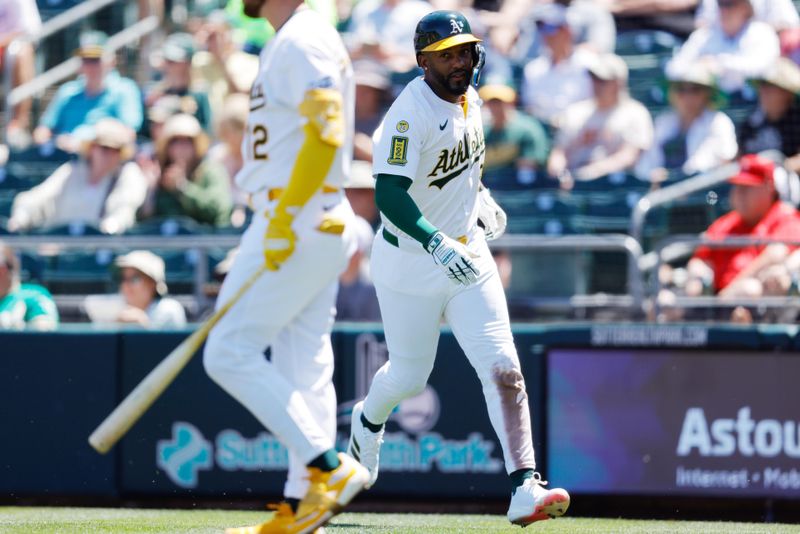 May 22, 2025; West Sacramento, California, USA; Athletics designated hitter Miguel Andujar (22) scores a run on a walk by Los Angeles Angels pitcher Hunter Strickland (60) during the fifth inning at Sutter Health Park. Mandatory Credit: Sergio Estrada-Imagn Images