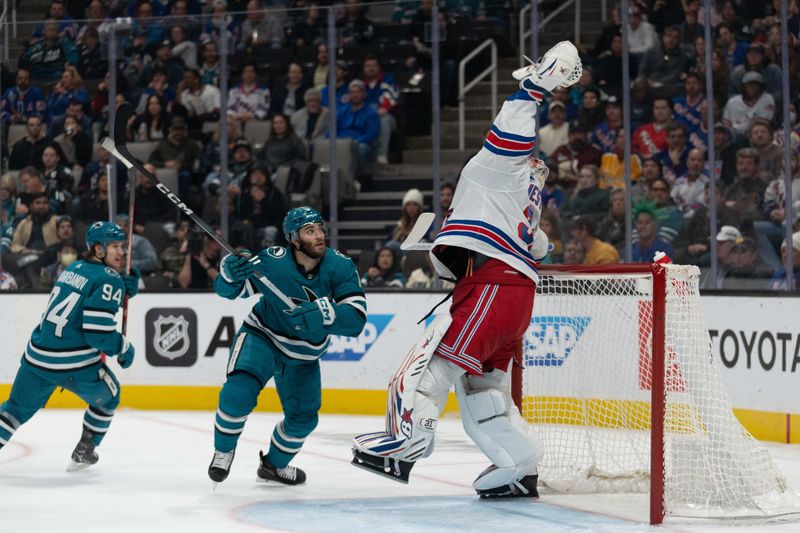 Jan 23, 2024; San Jose, California, USA; New York Rangers goaltender Igor Shesterkin (31) catches the puck during the second period against San Jose Sharks center Luke Kunin (11) at SAP Center at San Jose. Mandatory Credit: Stan Szeto-USA TODAY Sports