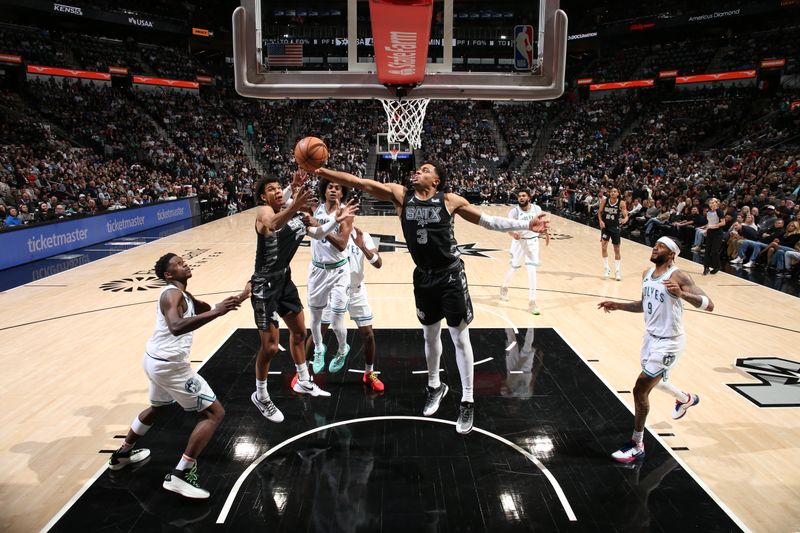 SAN ANTONIO, TX - JANUARY 27: Keldon Johnson #3 of the San Antonio Spurs grabs a rebound during the game against the Minnesota Timberwolves on January 27, 2024 at the Frost Bank Center in San Antonio, Texas. NOTE TO USER: User expressly acknowledges and agrees that, by downloading and or using this photograph, user is consenting to the terms and conditions of the Getty Images License Agreement. Mandatory Copyright Notice: Copyright 2024 NBAE (Photos by David Sherman/NBAE via Getty Images)