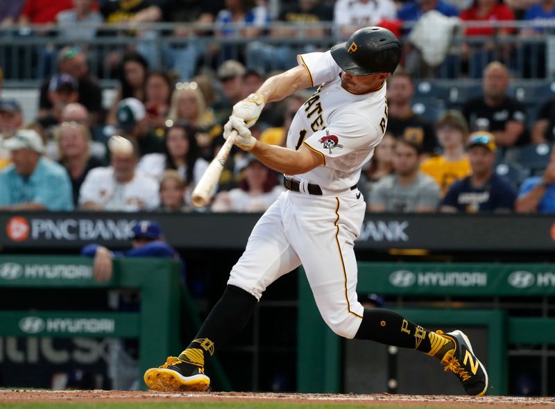 May 23, 2023; Pittsburgh, Pennsylvania, USA; Pittsburgh Pirates left fielder Bryan Reynolds (10) hits an RBI double against the Texas Rangers during the third inning at PNC Park. Mandatory Credit: Charles LeClaire-USA TODAY Sports