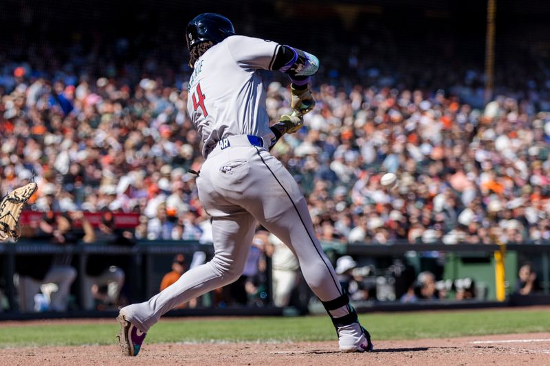 Apr 21, 2024; San Francisco, California, USA;  Arizona Diamondbacks second baseman Ketel Marte (4) hits an RBI single against the San Francisco Giants during the ninth inning at Oracle Park. Mandatory Credit: John Hefti-USA TODAY Sports