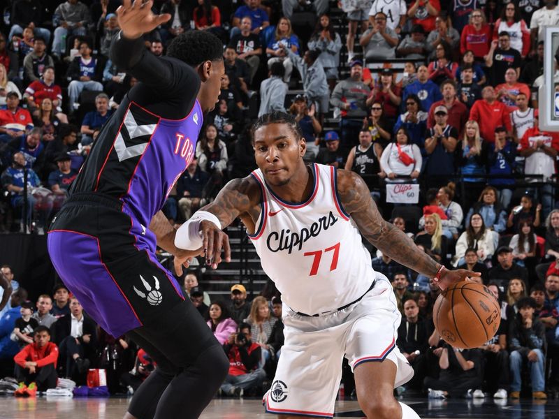 INGLEWOOD, CA - NOVEMBER 9: Kevin Porter Jr. #77 of the LA Clippers dribbles the ball during the game against the Toronto Raptors on November 9, 2024 at Intuit Dome in Los Angeles, California. NOTE TO USER: User expressly acknowledges and agrees that, by downloading and/or using this Photograph, user is consenting to the terms and conditions of the Getty Images License Agreement. Mandatory Copyright Notice: Copyright 2024 NBAE (Photo by Noah Graham/NBAE via Getty Images)