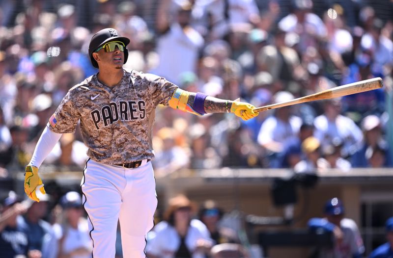 Jul 9, 2023; San Diego, California, USA; San Diego Padres third baseman Manny Machado (13) watches his two-run home run against the New York Mets during the fifth inning at Petco Park. Mandatory Credit: Orlando Ramirez-USA TODAY Sports