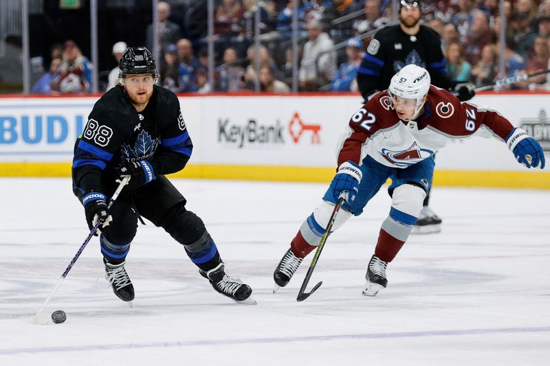 Feb 24, 2024; Denver, Colorado, USA; Toronto Maple Leafs right wing William Nylander (88) controls the puck as Colorado Avalanche left wing Artturi Lehkonen (62) defends in the first period at Ball Arena. Mandatory Credit: Isaiah J. Downing-USA TODAY Sports