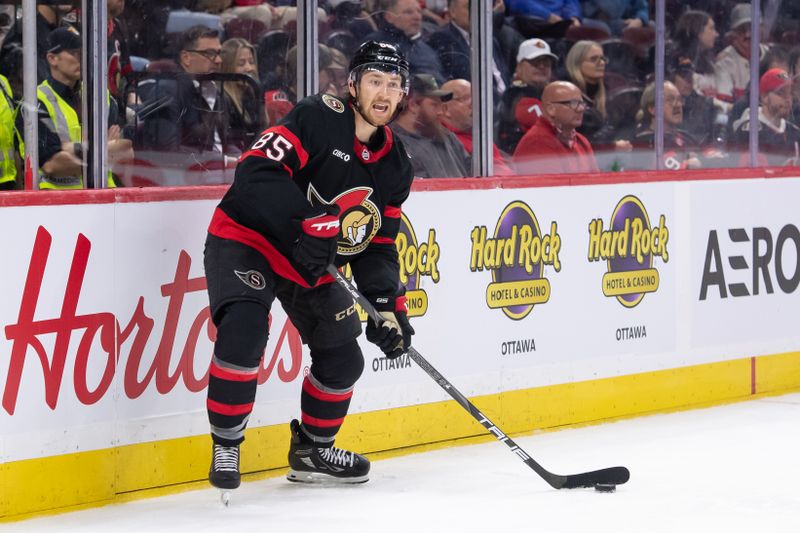 Oct 29, 2024; Ottawa, Ontario, CAN; Ottawa Senators defenseman Jake Sanderson (85) controls the puck in the second period against the St. Louis Blues at the Canadian Tire Centre. Mandatory Credit: Marc DesRosiers-Imagn Images