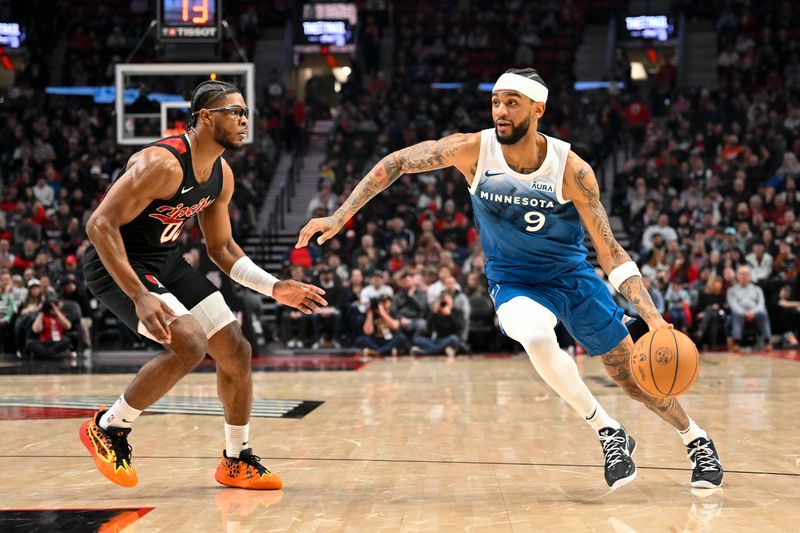 PORTLAND, OREGON - FEBRUARY 15: Nickeil Alexander-Walker #9 of the Minnesota Timberwolves dribbles against Scoot Henderson #00 of the Portland Trail Blazers during the second quarter of the game at the Moda Center on February 15, 2024 in Portland, Oregon. NOTE TO USER: User expressly acknowledges and agrees that, by downloading and or using this photograph, User is consenting to the terms and conditions of the Getty Images License Agreement. (Photo by Alika Jenner/Getty Images)