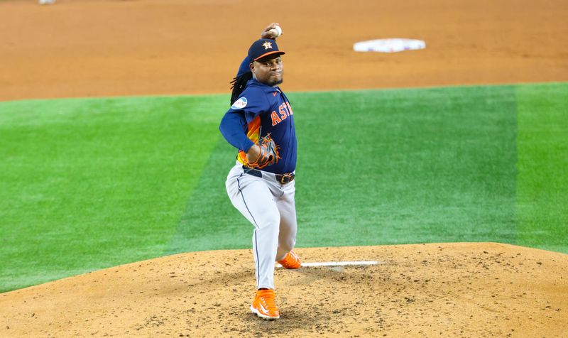 Aug 6, 2024; Arlington, Texas, USA;  Houston Astros starting pitcher Framber Valdez (59) throws during the fourth inning against the Texas Rangers at Globe Life Field. Mandatory Credit: Kevin Jairaj-USA TODAY Sports