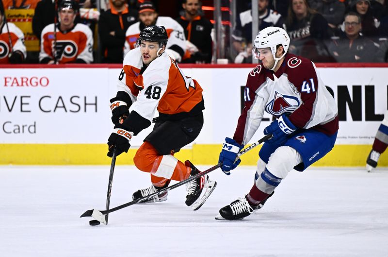 Jan 20, 2024; Philadelphia, Pennsylvania, USA; Philadelphia Flyers center Morgan Frost (48) and Colorado Avalanche right wing Jason Polin (41) battle for the puck in the first period at Wells Fargo Center. Mandatory Credit: Kyle Ross-USA TODAY Sports