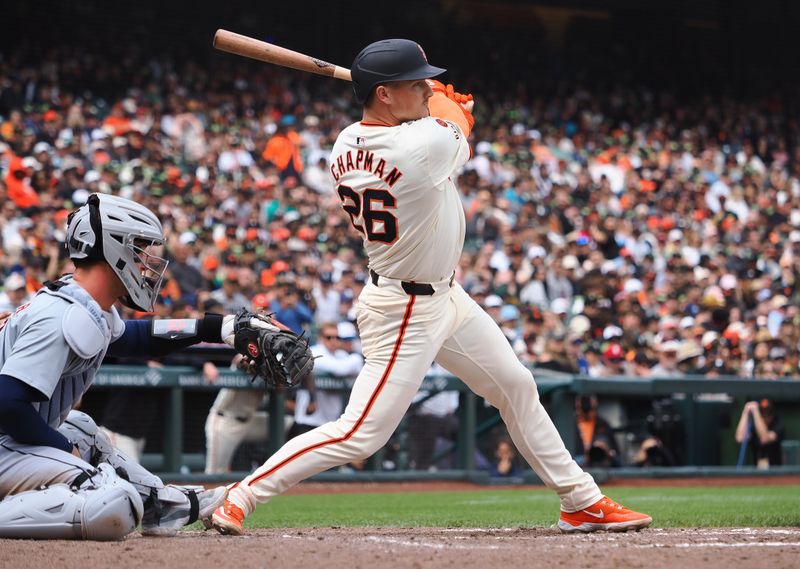 Aug 11, 2024; San Francisco, California, USA; San Francisco Giants third baseman Matt Chapman (26) hits an RBI single against the Detroit Tigers during the sixth inning at Oracle Park. Mandatory Credit: Kelley L Cox-USA TODAY Sports