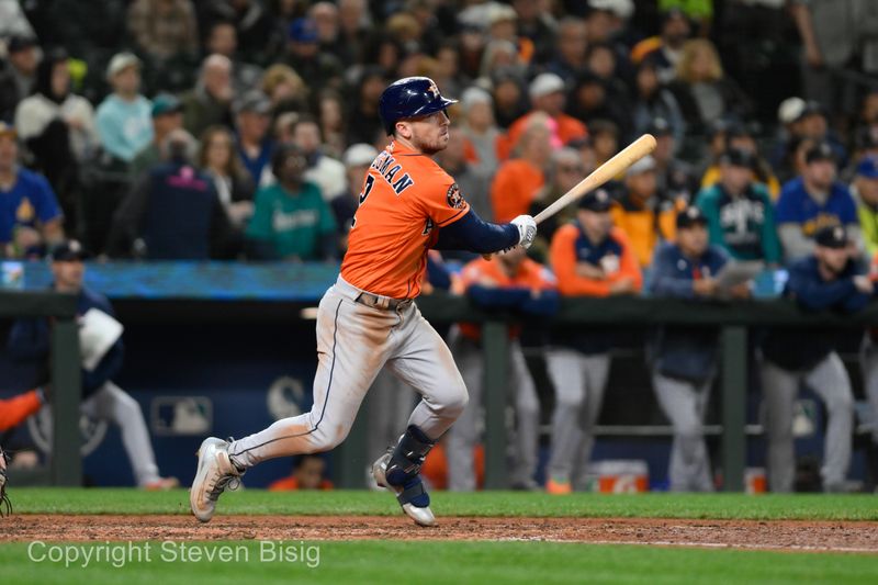 Sep 27, 2023; Seattle, Washington, USA; Houston Astros third baseman Alex Bregman (2) hits a triple against the Seattle Mariners during the seventh inning at T-Mobile Park. Mandatory Credit: Steven Bisig-USA TODAY Sports