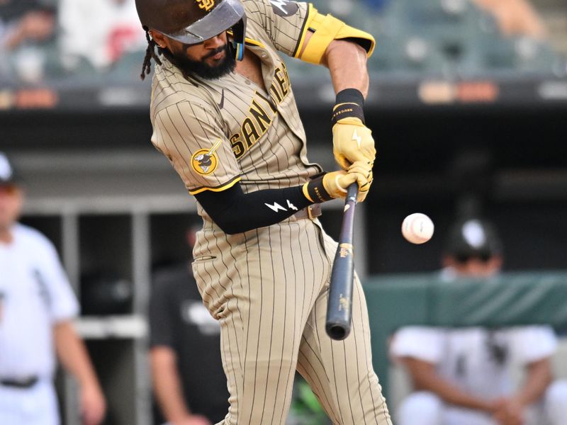 Sep 21, 2025; Chicago, Illinois, USA; San Diego Padres right fielder Fernando Tatis Jr. (23) hits a single against the Chicago White Sox during the seventh inning at Rate Field. Mandatory Credit: Patrick Gorski-Imagn Images