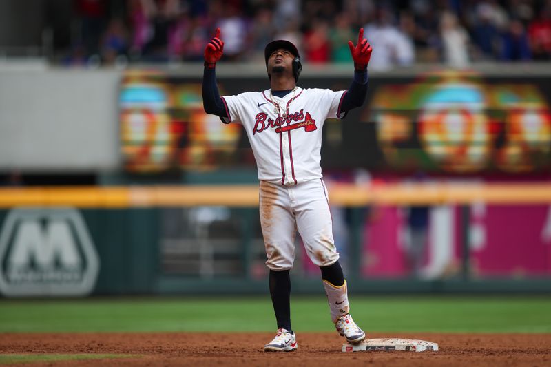 Sep 30, 2024; Atlanta, Georgia, USA; Atlanta Braves second baseman Ozzie Albies (1) celebrates after a three-run double against the New York Mets in the eighth inning at Truist Park. Mandatory Credit: Brett Davis-Imagn Images
