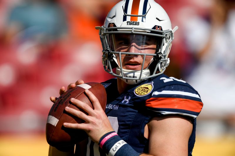 Jan 1, 2020; Tampa, Florida, USA; Auburn Tigers quarterback Bo Nix (10) warms up prior to the game between the Auburn Tigers and the Minnesota Golden Gophers at Raymond James Stadium. Mandatory Credit: Douglas DeFelice-USA TODAY Sports