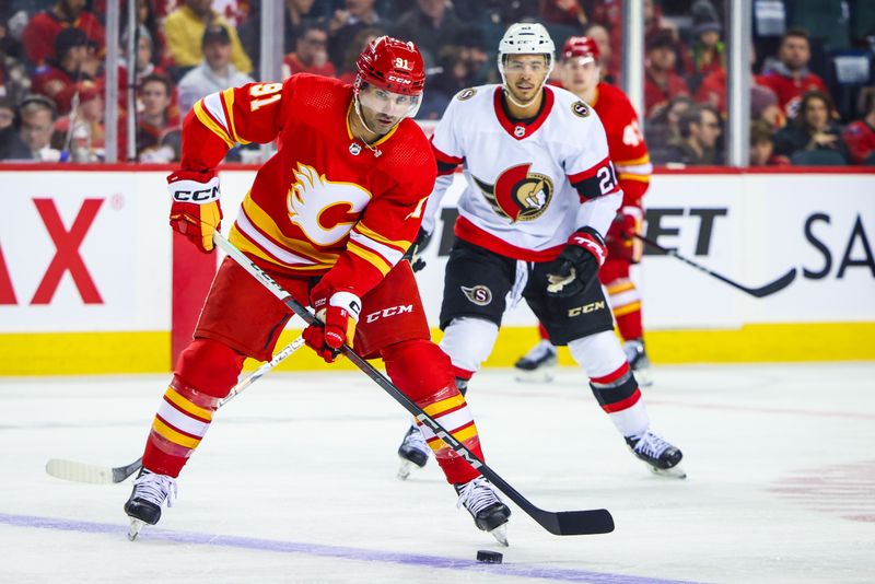 Jan 9, 2024; Calgary, Alberta, CAN; Calgary Flames center Nazem Kadri (91) controls the puck against the Ottawa Senators during the third period at Scotiabank Saddledome. Mandatory Credit: Sergei Belski-USA TODAY Sports