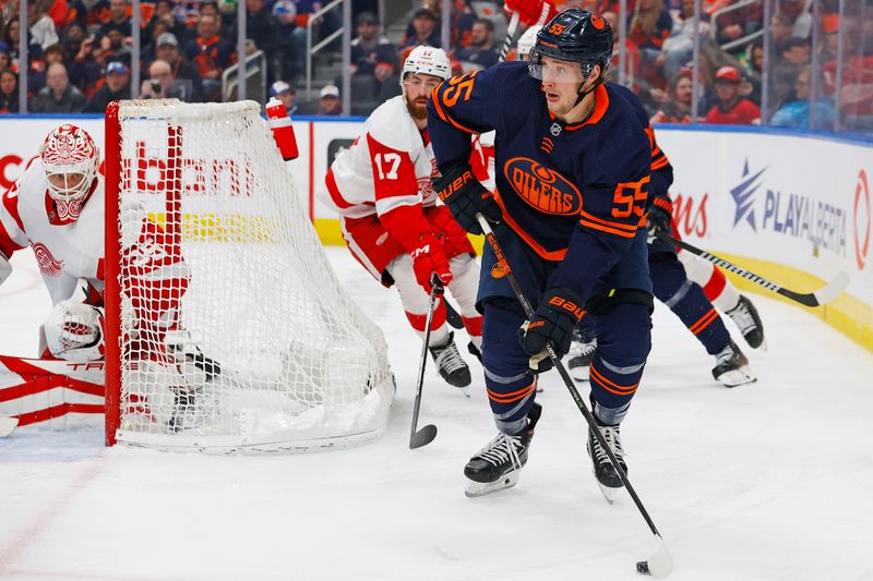 Feb 15, 2023; Edmonton, Alberta, CAN; Edmonton Oilers forward Dylan Holloway (55) looks to make a pass in front of Detroit Red Wings defensemen Filip Hronek (17) during the third period at Rogers Place. Mandatory Credit: Perry Nelson-USA TODAY Sports