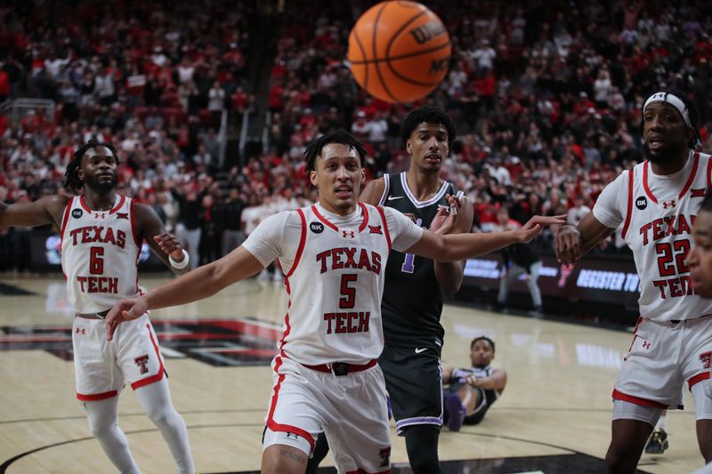 Jan 13, 2024; Lubbock, Texas, USA;  Texas Tech Red Raiders guard Darrion Williams (5) watches the ball go out of bounds in front of Kansas State Wildcats wing David N Guessan (1) in the second half at United Supermarkets Arena. Mandatory Credit: Michael C. Johnson-USA TODAY Sports