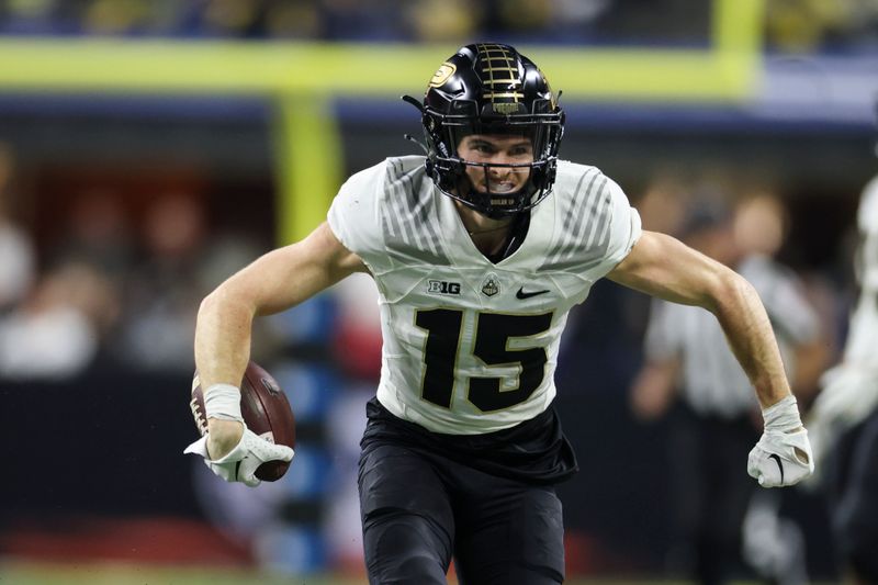 Dec 3, 2022; Indianapolis, Indiana, USA; Purdue Boilermakers wide receiver Charlie Jones (15) reacts after a long reception during the first half of the Big Ten Championship against the Michigan Wolverines at Lucas Oil Stadium. Mandatory Credit: Trevor Ruszkowski-USA TODAY Sports