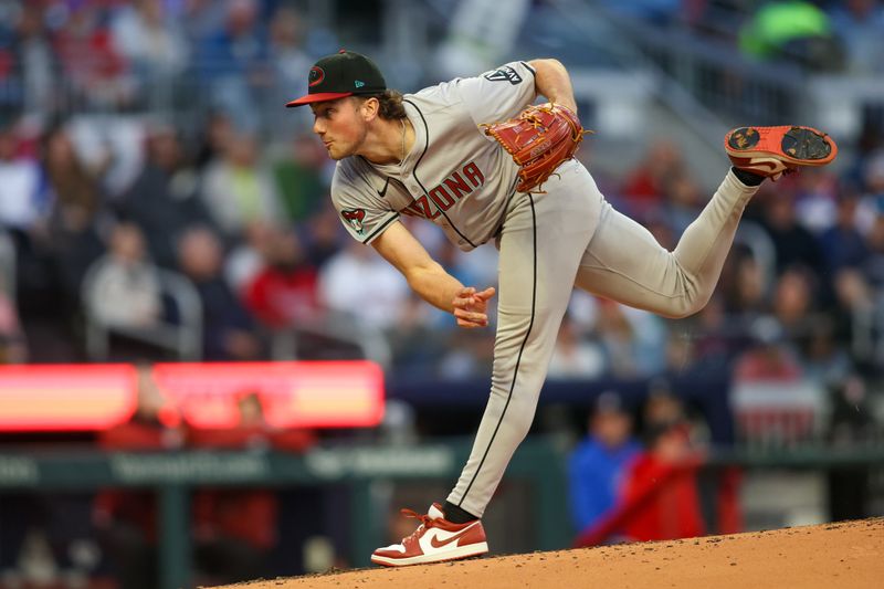 Apr 6, 2024; Atlanta, Georgia, USA; Arizona Diamondbacks starting pitcher Brandon Pfaadt (32) throws a pitch against the Atlanta Braves in the second inning at Truist Park. Mandatory Credit: Brett Davis-USA TODAY Sports