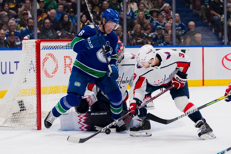 Mar 16, 2024; Vancouver, British Columbia, CAN; Washington Capitals defenseman Nick Jensen (3) battles with Vancouver Canucks forward Brock Boeser (6) as goalie Charlie Lindgren (79) watches in the first period at Rogers Arena. Mandatory Credit: Bob Frid-USA TODAY Sports