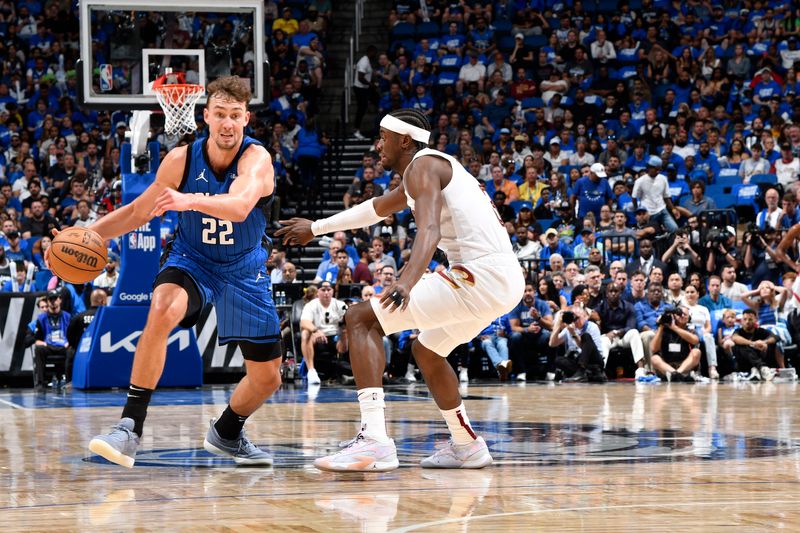 ORLANDO, FL - APRIL 27: Franz Wagner #22 of the Orlando Magic dribbles the ball during the game against the Cleveland Cavaliers during Round 1 Game 4 of the 2024 NBA Playoffs on April 27, 2024 at the Kia Center in Orlando, Florida. NOTE TO USER: User expressly acknowledges and agrees that, by downloading and or using this photograph, User is consenting to the terms and conditions of the Getty Images License Agreement. Mandatory Copyright Notice: Copyright 2024 NBAE (Photo by Fernando Medina/NBAE via Getty Images)