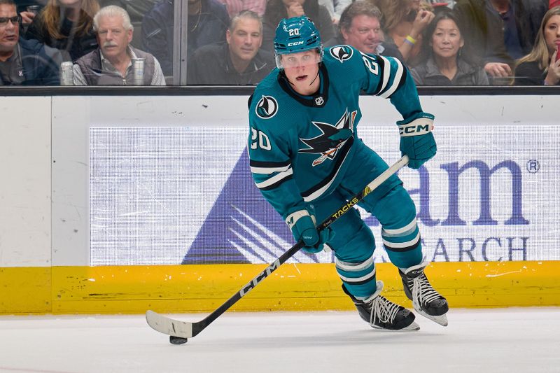 Dec 12, 2023; San Jose, California, USA; San Jose Sharks left wing Fabian Zetterlund (20) skates with the puck against the Winnipeg Jets during the second period at SAP Center at San Jose. Mandatory Credit: Robert Edwards-USA TODAY Sports