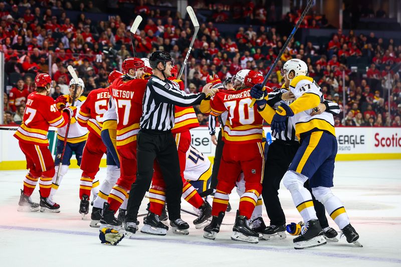 Jan 3, 2026; Calgary, Alberta, CAN; Calgary Flames left wing Ryan Lomberg (70) and Nashville Predators right wing Cole Smith (36) fight during the first period at Scotiabank Saddledome. Mandatory Credit: Sergei Belski-Imagn Images
